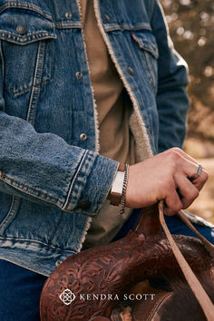 Wear something unexpected when you style the Maverick Leather Bracelet. A leather band with hammered Sterling Silver details, this bracelet effortlessly blends mixed materials into a cohesive design that’s both rugged and timeless. This bracelet is a part of Yellow Rose by Kendra Scott—a brand that celebrates ranch life with Kendra Scott staples alongside select curated jewelry pieces and accessories. Ranch Life, Hammered Sterling Silver, Gorgeous Gift, Men's Accessories, Yellow Roses, Yellow Rose, Leather Band, Kendra Scott, Best Friend Gifts