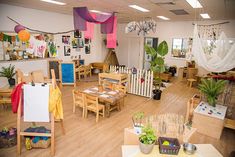 a room filled with wooden tables and chairs