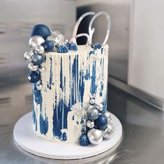 a blue and white cake decorated with ornaments