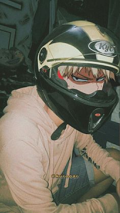 a man wearing a motorcycle helmet with his mouth open