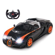 an orange and black toy car with steering wheel