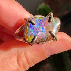 Ammolite Sterling Silver Ring Size 9. Ammolite Fossil cabochon has protective resin coating. Hematite Ring, Quartz Crystal Pendant, Resin Coating, Quartz Necklace, Amethyst Crystal, Crystal Pendant, Sterling Silver Ring, Quartz Crystal, Fossil