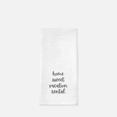 a tea towel with the words home sweet vacation rental printed on it in black ink