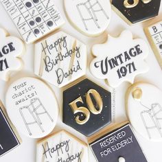 decorated cookies with 50th birthday designs and numbers on them for someone's 50th celebration