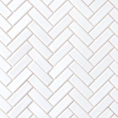 white herringbone tile pattern that looks like it could be used for wallpaper or flooring