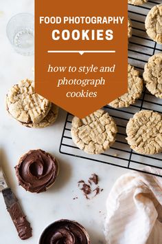 cookies on a cooling rack with chocolate frosting and cookie cutters next to them