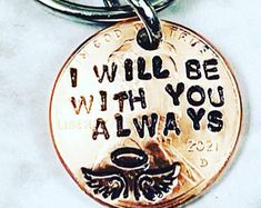 i will be with you always keychain on a white surface, featuring the words