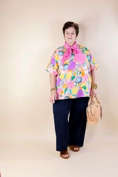 Elevate your style to a whole new level with our "Majestic Moment" poncho top. Bursting with charm, this top boasts a delightful fruit and floral print in vibrant spring colors, adding a touch of whimsy to any ensemble. The poncho silhouette offers an oversized fit, ensuring comfort without compromising on style. With drop sleeves and a chic V-neckline, it effortlessly combines fashion and flair. Step into the spotlight and make every moment majestic with this statement piece. Available in sizes Fruit Print Tops For Beach In Spring, Spring Pink Tops With Fruit Print, Pink Fruit Print Tops For Spring, Multicolor Fruit Print Tops For Spring, Multicolor Fruit Print Spring Top, Oversized Pink Floral Print Top, Poncho Top, Giddy Up Glamour, Poncho Tops