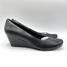 Clarks Women's Flores Tulip Classic Black Leather Comfort Wedge Pumps. Women's Size 11 Regular / Medium Width. Condition: New In Box; Box Has Wear. New To Poshmark? Sign Up Using Invite Code: Tentoday For $10 Off Your Purchase! Casual Career Professional Work Everyday Classic Office Comfort Date Night Out Modern Summer Winter Fall Spring Blogger Casual Minimalist Trends Trendy Favorite Fashion Comfortable Every Day Wardrobe Staple 90s 90's Y2k Ballet Flats Slip On Loafers Pointed Pointy Point To Elegant Synthetic Wedge Sandals For Work, Office Heels With Round Toe In Synthetic Material, Spring Office Court Shoes With Wedge Heel, Wedge Heel Court Shoes With Padded Heel, Closed Toe Wedge Sandals For Work, Classic Slip-on Synthetic Heels, Court Shoes With Padded Heel And Wedge Shape, Synthetic Closed Toe Heels For Office, Medium Width Court Shoes With Padded Heel And Wedge