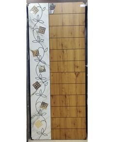 a wooden door with decorative designs on the front and side panels, along with an adhesive sticker