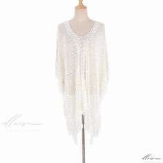 Elluis - Seaside Retreat Knitted Hollow Edge Resort Cover-up: Versatile Beachwear for Bikinis, Protective Swimwear, and Stylish Sun Protection White Knit Beachwear Cover-up, White Knitted Cover-up For Vacation, Stretch Knit Crochet Top For Vacation, White Knit Crochet Top For Beach Season, Beige Knit Summer Cover-up, Casual White Cover-up For Holiday, Beach V-neck Crochet Top, Beige Stretch Crochet Top For The Beach, Bohemian Knitted Beach Cover-up