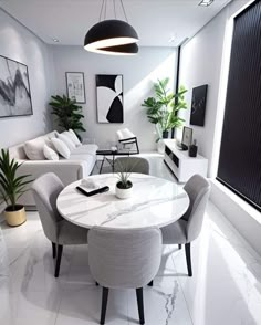 a modern living room with white walls and marble table surrounded by chairs, couches and potted plants