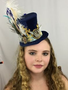 This gorgeous Blue Velvet Steampunk Top Hat will be the perfect finishing touch for your formal wear.  Victorian detailing with custom made silk ribbons and vintage timepiece - this hat is a stunner! Adjustable High Crown Top Hat For Themed Events, Fitted High Crown Costume Hats For Themed Events, Fitted High Crown Hats For Themed Events, Vintage Mini Hats With High Crown For Themed Events, Victorian Style Adjustable Costume Hats For Formal Events, Vintage Curved Brim Top Hat For Costume Party, Vintage Top Hat With Curved Brim For Costume Party, Ceremonial Blue Adjustable Hat, Adjustable Blue Ceremonial Hats