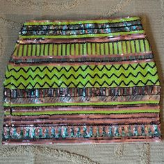 a multicolored skirt with sequins on the bottom and stripes in different colors