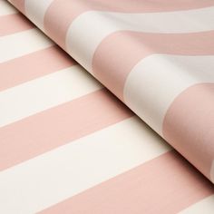 a pink and white striped wallpaper with horizontal stripes on it's surface,