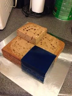 three pieces of bread sitting on top of a piece of tin foil