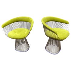 pair of knoll chairs with lime green upholstered cushions