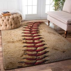 a baseball rug is on the floor in a living room