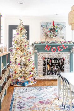 a living room with a christmas tree in the corner and decorations on the fireplace mantel