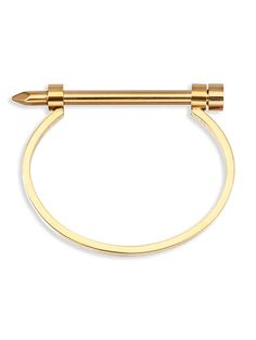 a pair of gold colored metal rings with an arrow on the end, and one ring is