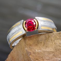 Ruby Engagement Ring with Meteorite Modern Ruby Ring For Formal Occasions, Modern Ruby Rings With Bezel Setting, Modern Round Ruby Ring, Modern Oval Ruby Ring, Red Ruby Ring Channel Set For Wedding, Red Ruby Channel Set Ring For Wedding, Elegant Red Ruby Ring With Channel Set, Red Ruby Ring With Channel Set, Red Channel Set Ruby Ring For Wedding