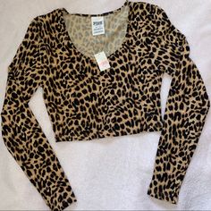 New With Tags Victoria’s Secret Pink Long Sleeve Figure Hugging Crop Top With All Over Leopard Print. Fits As Shown On Model In The Last Photo Wearing A Similar Style In Black. Size: Xs Sleeve Length Measures Approx. 22 Inches Shoulder To Hem Measures Approx. 14 Inches. Armpit To Armpit Measures Approx 13 Inches. Victoria's Secret Pink Tops With Letter Print, Pink Zebra Print Top, Fitted Pink Victoria's Secret Top, Fitted Leopard Print Sleeveless Crop Top, Leopard Print Tank Top Y2k, Pink Long Sleeve, Pink Leopard Print, Print Crop Tops, Pink Leopard