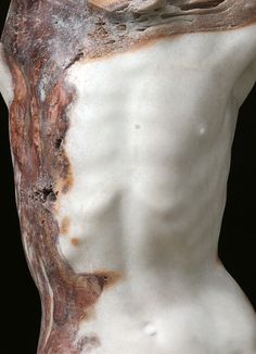 a close up of a white and brown marble sculpture with an interesting pattern on it's body