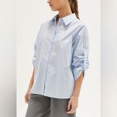 Brand New With Tags! Light Blue. Size Xs. Button Down Shirt Open Back With Tie Detail Tab Sleeves 100% Cotton Trendy Blue Shirt With Button Cuffs, Chic Blue Shirt For Everyday, Chic Blue Everyday Shirt, Chic Everyday Blue Shirt, Blue Tops With Roll-up Sleeves For Everyday, Blue Blouse With Button Cuffs For Everyday, Blue Tops With Button Cuffs For Everyday, Light Blue Tops With Button Cuffs For Daywear, Blue Everyday Shirt With Button Cuffs