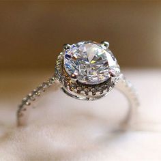 a close up view of a diamond ring with diamonds on it's sidestone