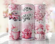 three pink tins with snowmen and christmas decorations on them, all decorated in different designs