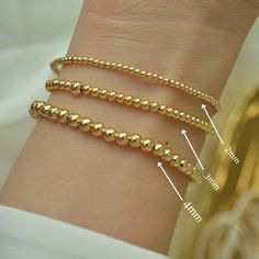 ** BUY ANY THREE (3) ITEMS AND GET 20%OFF ON YOUR ENTIRE PURCHASE ** Gold Bead Bracelet, Beaded Bracelet, Gold Bracelet, 18K Gold Filled Bead Bracelet, Stacking Bracelet 2mm 3mm 4mm, Dainty Bracelet Classic 18k gold-filled bead bracelet is a perfect addition to a dainty stack this spring/summer season. The beads are strung on a premium stretch cord. SOLD BY ONE BRACELET ITEMS DETAILS: Water Resistant -Nickel-free - Allergy-free - Hypoallergenic - 18K gold-filled bead bracelets - round bead size Minimalist Stackable Bracelets With Round Beads, Minimalist Beaded Bracelets With Tiny Beads, Minimalist Tiny Beaded Bracelets, Minimalist Hypoallergenic Round Bead Bracelets, Flexible Bracelets With Tiny Beads As A Gift, Minimalist Stackable Beaded Bracelets, Minimalist Bracelets With Tiny Beads, Minimalist Round Bracelet With Tiny Beads, Minimalist Hypoallergenic Beaded Round Bracelets