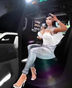 a woman sitting in the driver's seat of a car wearing heels and white top