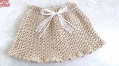 a crocheted skirt with a bow on the front