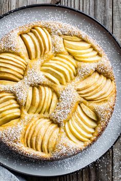 an apple pie with powdered sugar on top