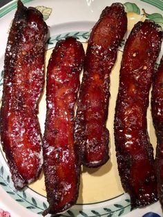 bacon strips sitting on top of a white plate