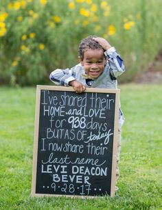 a little boy holding a sign that says i've shared their home and over