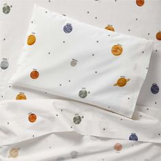 an image of a bed with planets on it