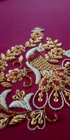 an elaborately designed piece of cloth with gold and red trimmings on it