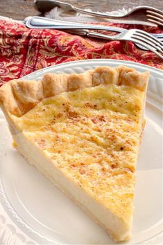 a slice of cheese pie on a white plate