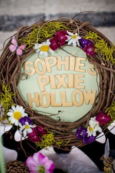 there is a wreath with flowers and words on it that says, sophiie pike hollow