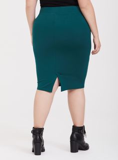 A thick ponte knit skirt stretches and smooths while maintaining its shape. Ponte fabric. Thick elasticized waist. Vented back. CONTENT + CARE: Rayon/nylon/spandex. Wash cold; line dry. Imported plus size skirt. SIZE + FIT: Model is 5'10”, size 1. Size 2 measures 26” from waist to hem. The best plus size women's midi studio luxe ponte pencil skirt skirts in green made of studioponte. These dressy clothes and work-wear, office-wear, career-wear, and business-wear will make you look professional to nail your job interview and wear to work every day. Torrid is your destination for cozy fall and winter clothes to keep you warm and comfortable. Stretch Elastane Skirt In Solid Color, Fitted Green Elastane Skirt, Chic Bodycon Stretch Bottoms, Chic Bodycon Elastane Bottoms, Flattering Stretch Knee-length Skirt, Flattering Knee-length Stretch Skirt, Stretch Pencil Skirt With Side Zipper, Bodycon Pencil Skirt In Elastane, Stretch Elastic Waistband Pencil Skirt