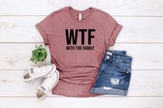 a women's t - shirt with the words our acting kinda sus on it