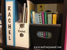 a book shelf filled with books and binders