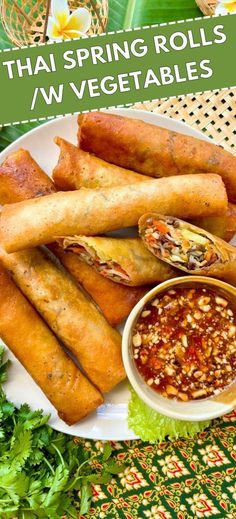 an image of spring rolls and vegetables on a plate