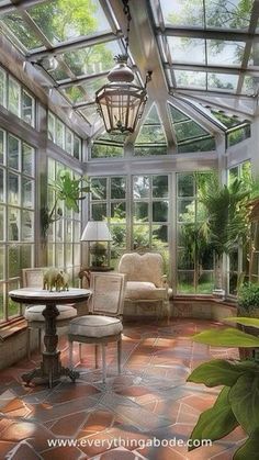 a sun room filled with lots of windows and furniture