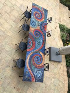 an overhead view of a table and chairs on a patio