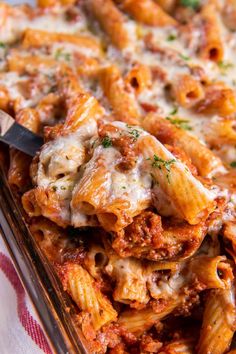 a casserole dish with meat and cheese on it, ready to be eaten