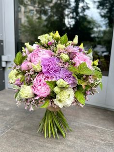 a bouquet of flowers sitting on the ground