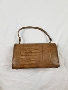 "Good vintage condition, has a few oil? stains on bottom and one on back, see photos. Skin is in good shape, so is handle, also interior. Good working clasp. 9x6x4\" Sterling, USA Genuine lizard" Vintage Brown Leather Bag, Animal Print Handbags, Snake Skin Handbag, Drawstring Purse, Black Gold Chain, Mini Coin Purse, Handbag Vintage, Brown Leather Handbags, Printed Handbags