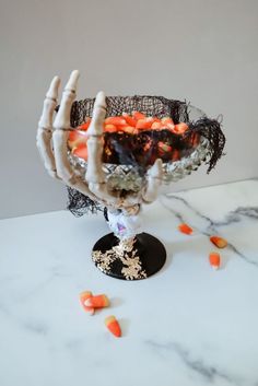 a halloween decoration made out of branches and candy